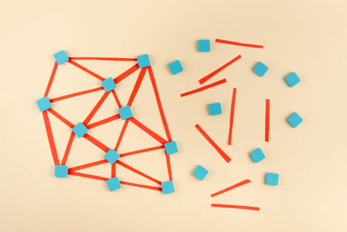 A pattern of blue and red sticks symbolizes fragmented digital content in a university's ecosystem.